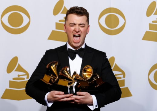 Sam Smith poses with his awards for Best New Artist, Best Pop/Vocal Album for "In the Lonely Hour" and Song of the Year and Record of the Year for "Stay With Me" in the press room at the 57th annual Grammy Awards in Los Angeles, California February 8, 2015. REUTERS/Mike Blake (UNITED STATES - Tags: ENTERTAINMENT TPX IMAGES OF THE DAY) (GRAMMYS-BACKSTAGE) - RTR4ORHT